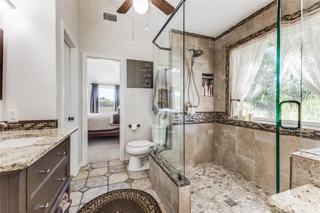 2525 Private Road 6040 Blue Ridge, TX 75424 - Photo 17 of 40 a bathroom with a granite countertop sink toilet and shower