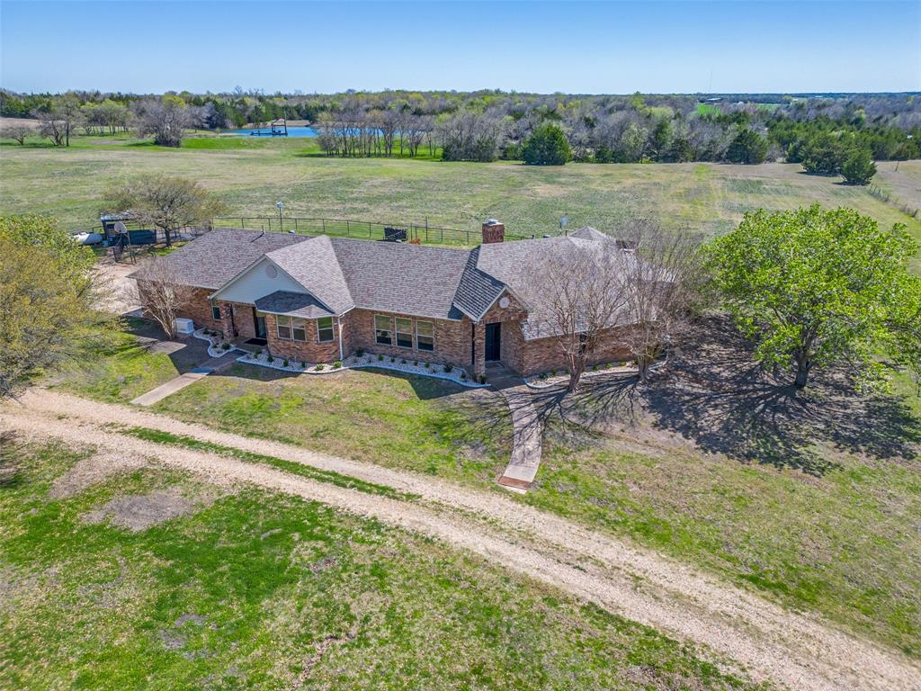 2525 Private Road 6040 Blue Ridge, TX 75424 - Photo 32 of 40 a view of a lake with lawn chairs and a big yard