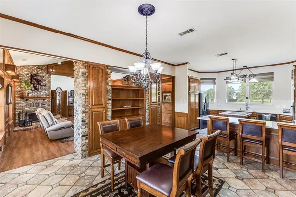 a dining room with furniture and window