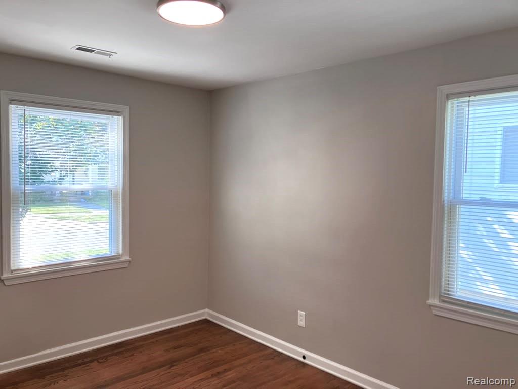 2034 Martin Road Ferndale, MI 48220 - Photo 16 of 18 Front bedroom features updated LED lighting, refinished oak floors and neutral paint.