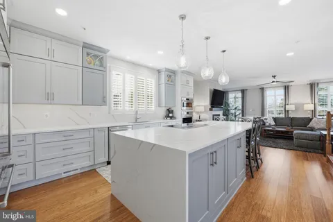 a kitchen with counter top space sink and center island