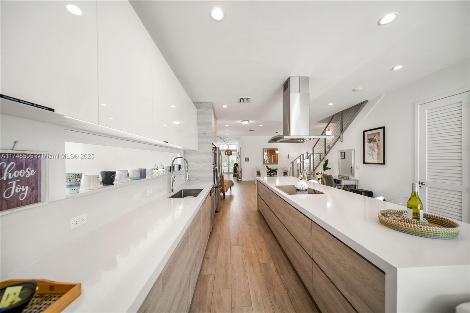 3570 Southwest 23rd Street, Unit 3570 Miami, FL 33145 - Photo 17 of 40 a large kitchen with stainless steel appliances a lot of counter space and a dining table