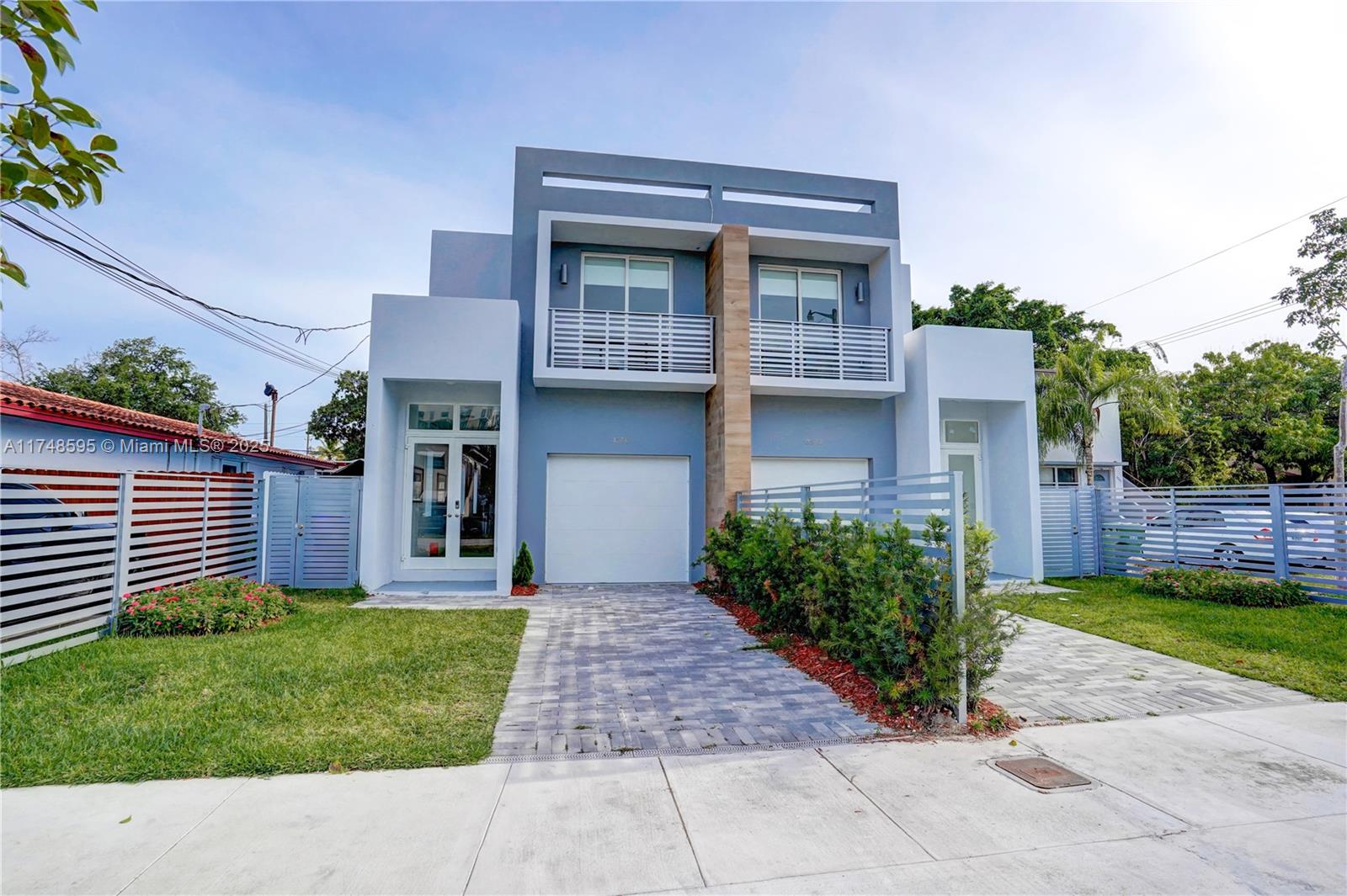 3570 Southwest 23rd Street, Unit 3570 Miami, FL 33145 - Photo 24 of 40 a front view of a house with a yard
