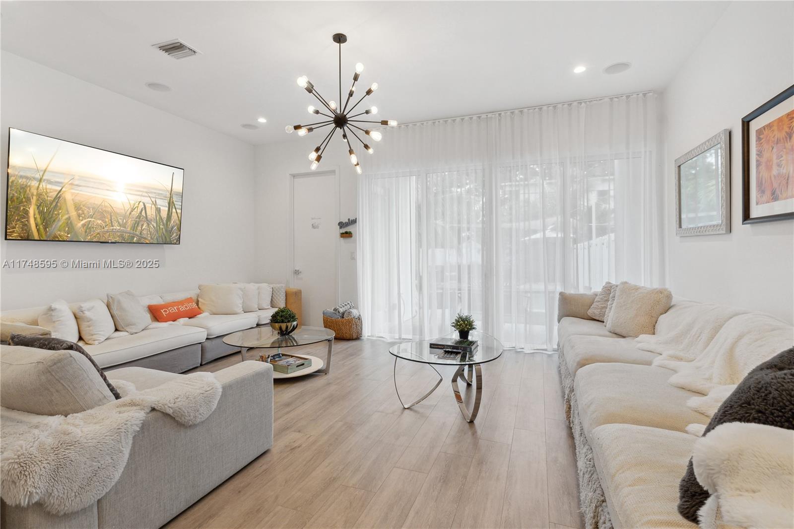 3570 Southwest 23rd Street, Unit 3570 Miami, FL 33145 - Photo 27 of 40 a living room with furniture and a flat screen tv