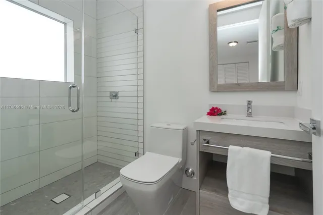 a bedroom with a bed and a chair