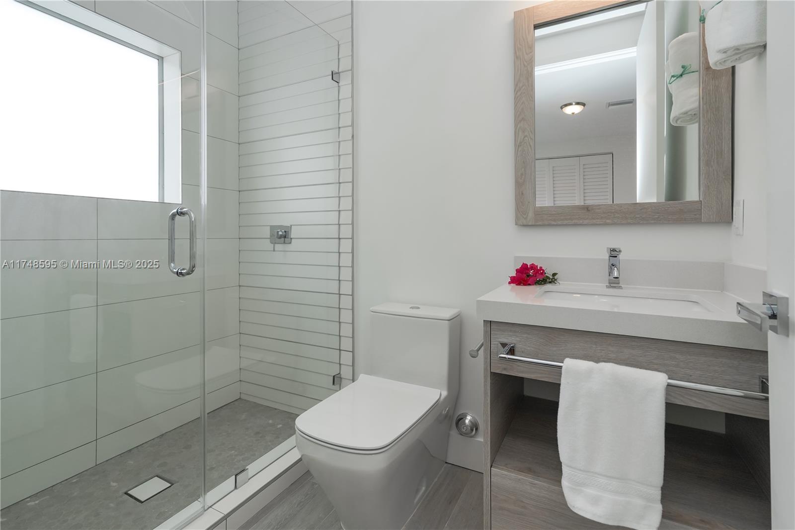 3570 Southwest 23rd Street, Unit 3570 Miami, FL 33145 - Photo 35 of 40 a bathroom with a sink toilet and shower