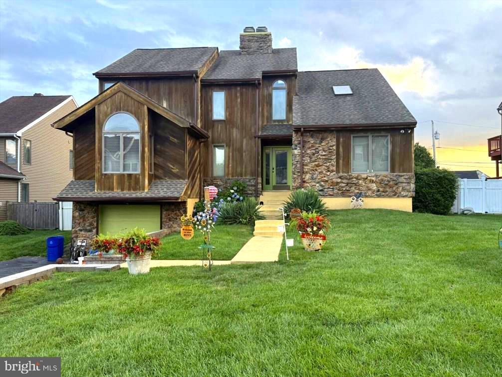 a front view of house with an outdoor space and seating