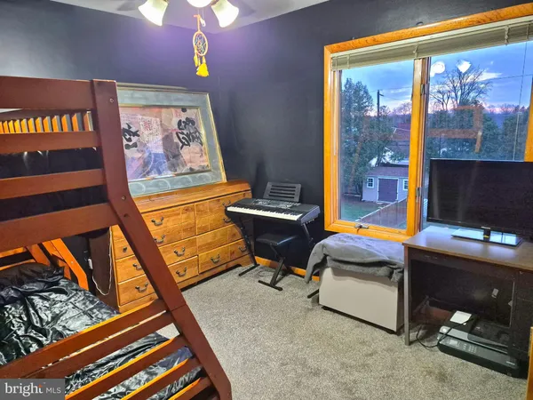 a room with furniture and flat screen tv