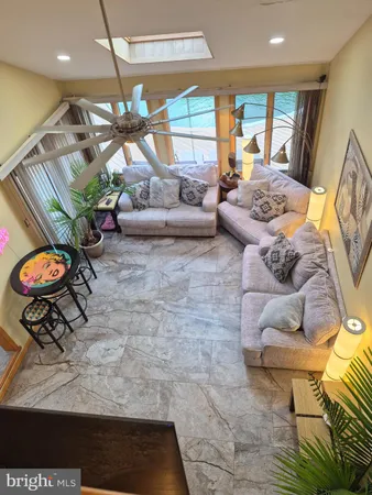 a living room with furniture and a table