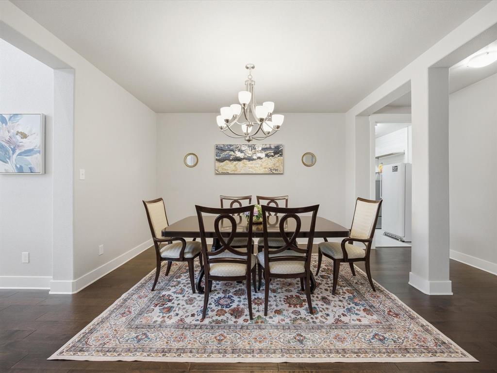 146 Old Bridge Road Waxahachie, TX 75165 - Photo 11 of 40 a view of a dining room with furniture and wooden floor
