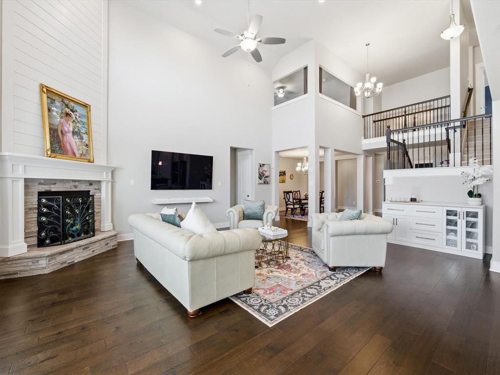 146 Old Bridge Road Waxahachie, TX 75165 - Photo 14 of 40 a living room with furniture a fireplace and a flat screen tv