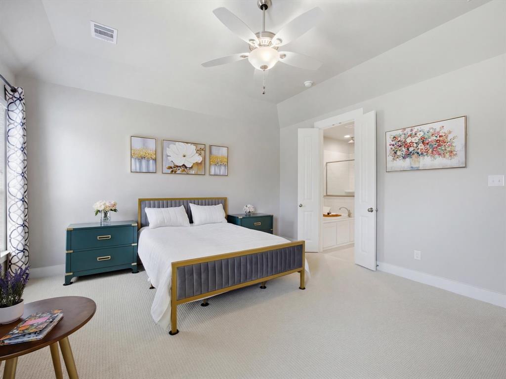 146 Old Bridge Road Waxahachie, TX 75165 - Photo 20 of 40 a bedroom with a bed and a table in it