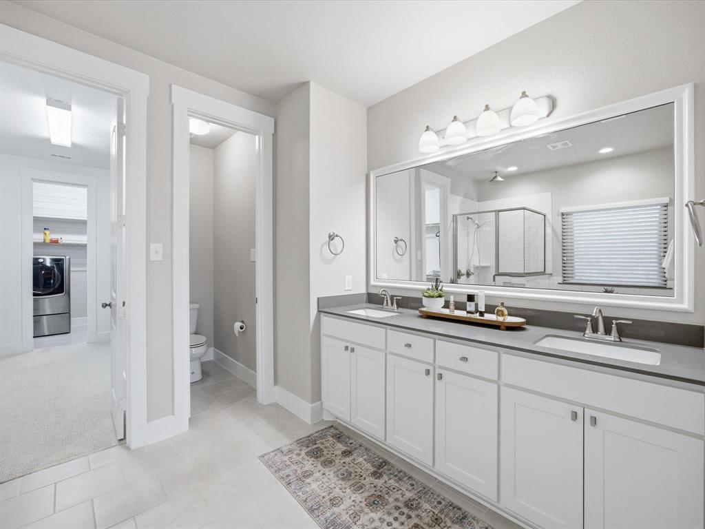 146 Old Bridge Road Waxahachie, TX 75165 - Photo 21 of 40 a bathroom with double sink and a mirror