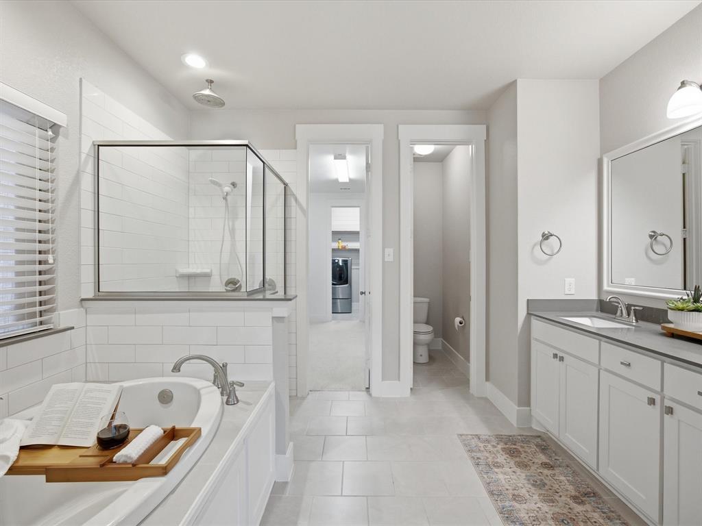 146 Old Bridge Road Waxahachie, TX 75165 - Photo 22 of 40 a bathroom with a tub sink and mirror