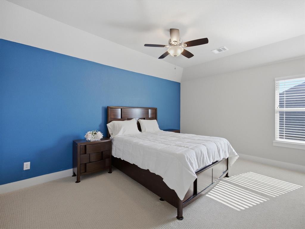 146 Old Bridge Road Waxahachie, TX 75165 - Photo 23 of 40 a bedroom with a bed and window
