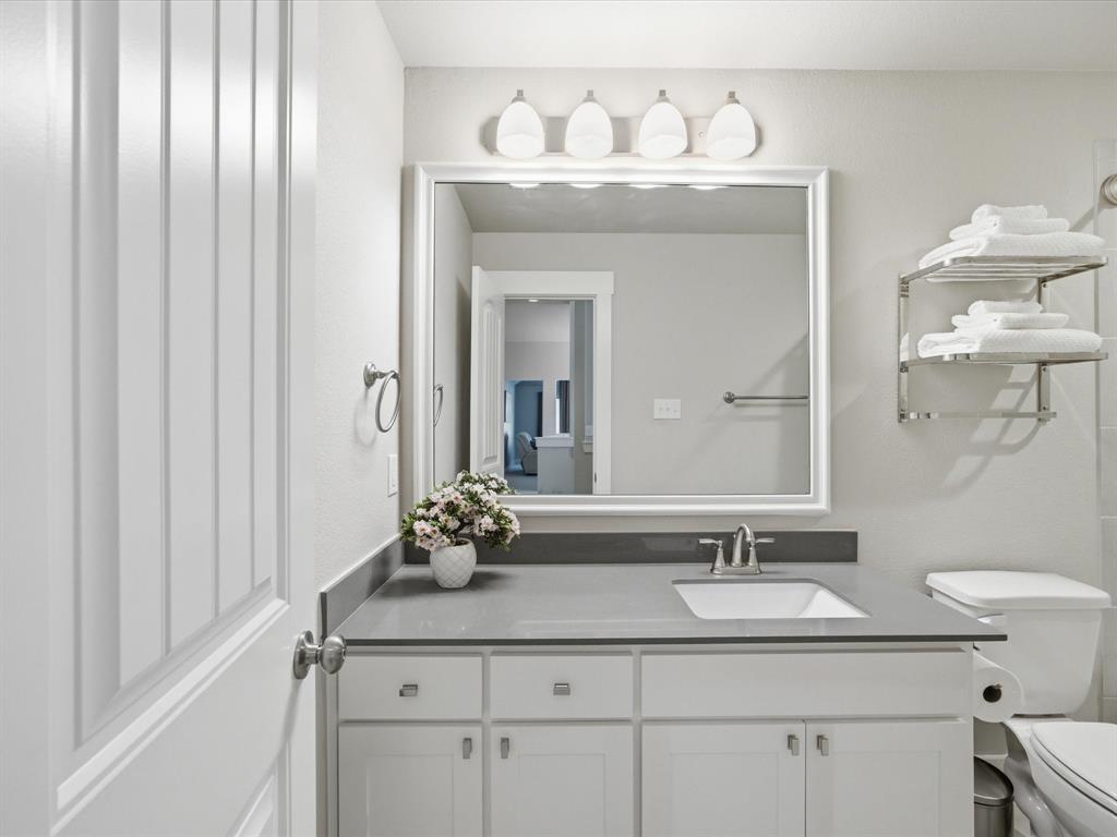 146 Old Bridge Road Waxahachie, TX 75165 - Photo 26 of 40 a bathroom with a sink vanity and a mirror