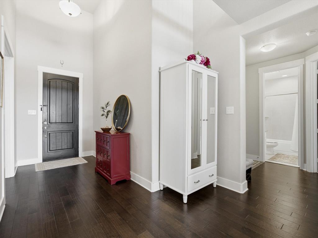 146 Old Bridge Road Waxahachie, TX 75165 - Photo 4 of 40 a view of a livingroom with wooden floor and workspace