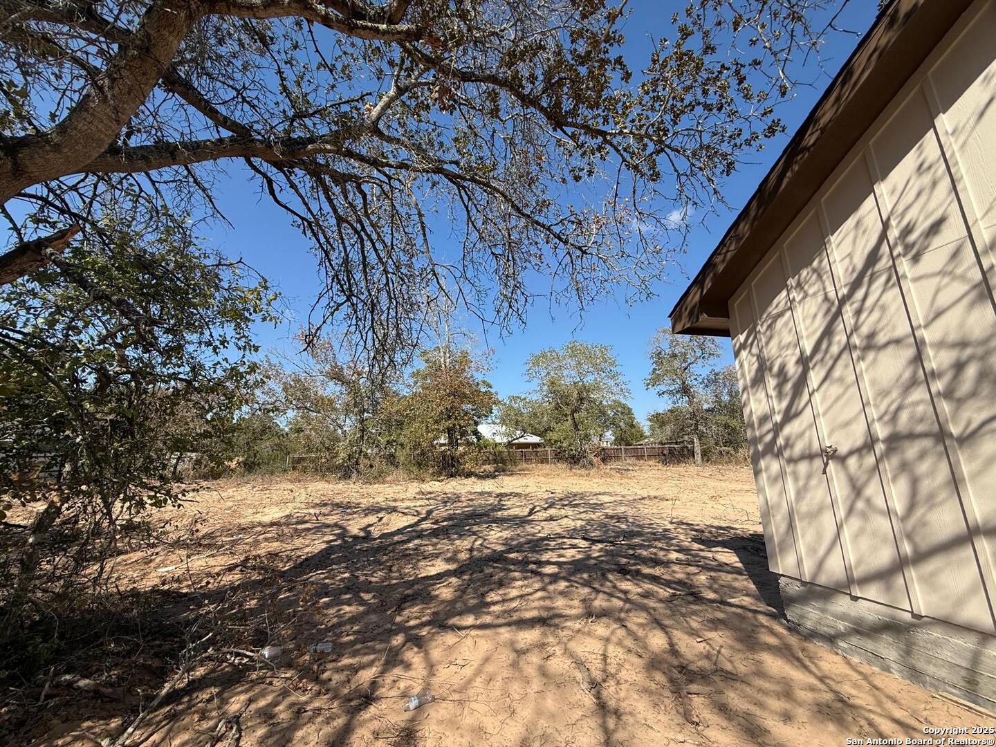 48 Grey Fox Poteet, TX 78065 - Photo 13 of 16 a view of a yard with a tree