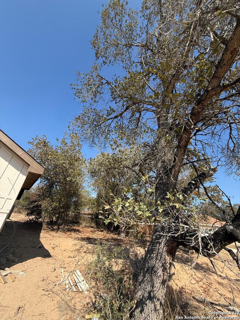 48 Grey Fox Poteet, TX 78065 - Photo 15 of 16 a view of a backyard of the house