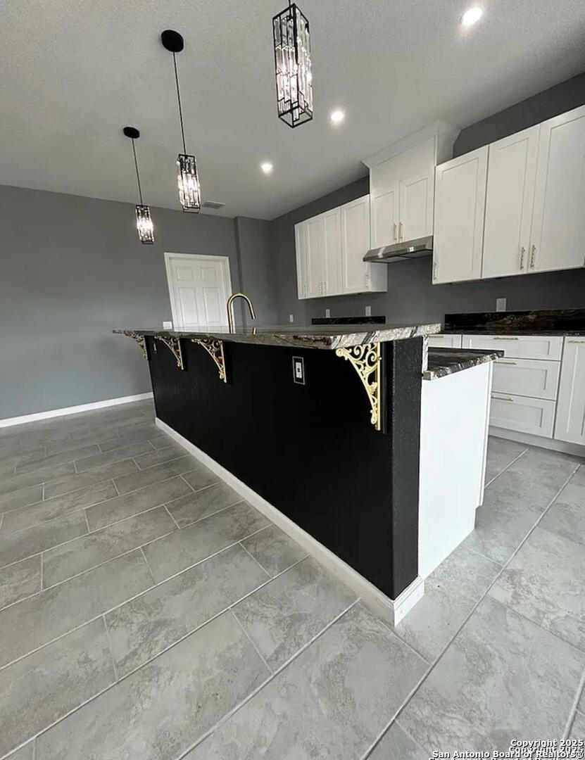 48 Grey Fox Poteet, TX 78065 - Photo 5 of 16 a kitchen with a sink a refrigerator and cabinets