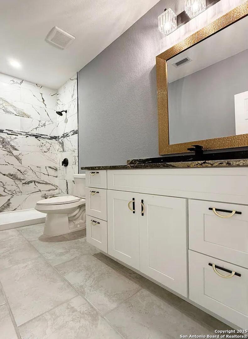 48 Grey Fox Poteet, TX 78065 - Photo 7 of 16 a bathroom with a sink and mirror