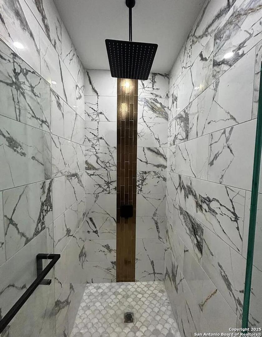 48 Grey Fox Poteet, TX 78065 - Photo 10 of 16 a bathroom with a shower and a sink