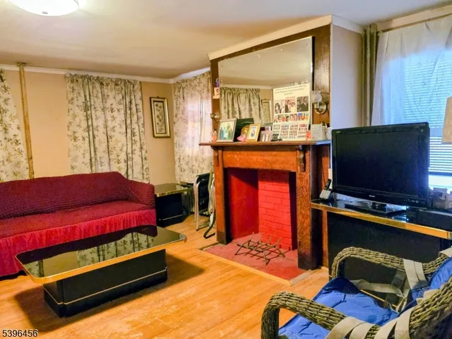 a bedroom with a bed and flat screen tv