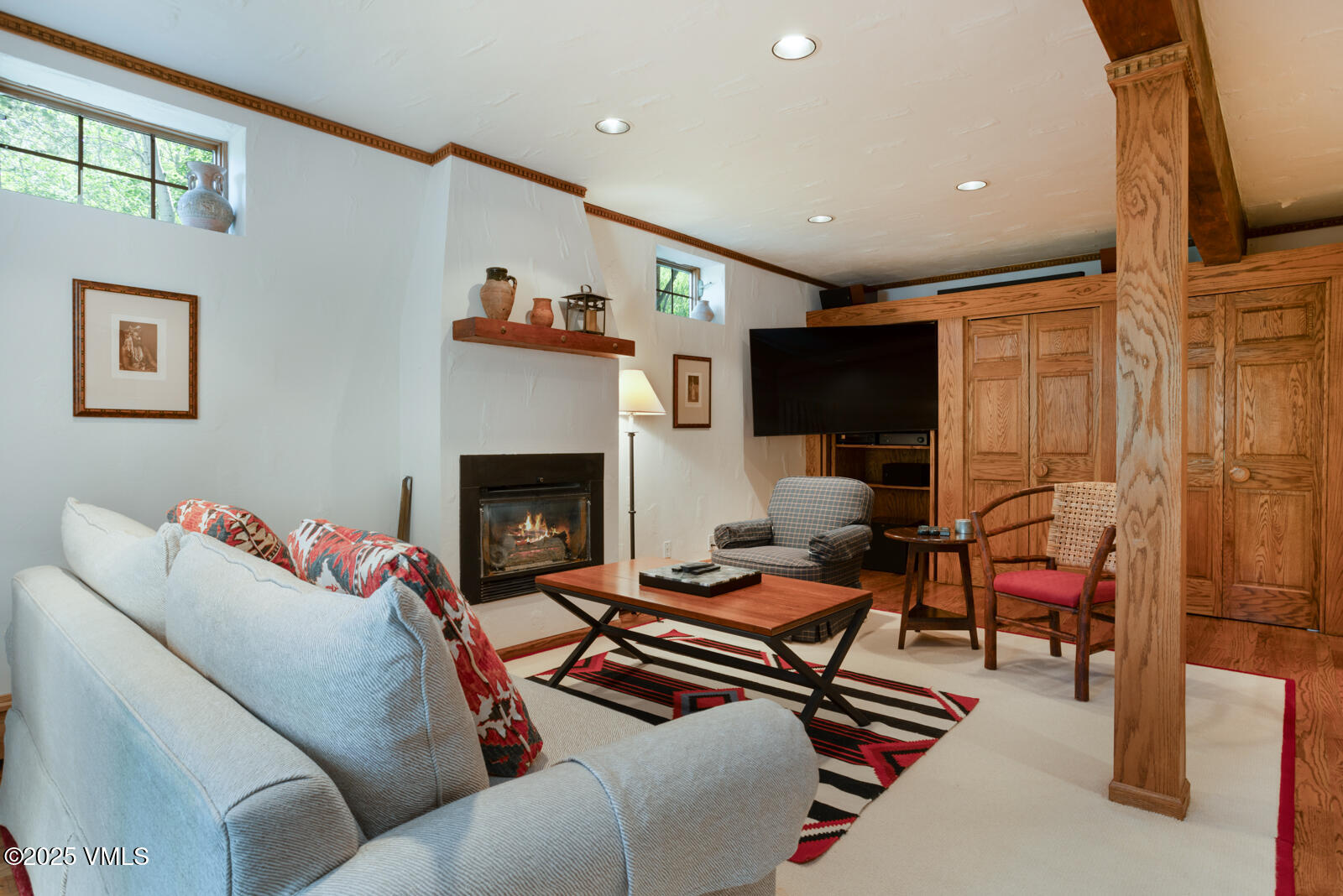 2111 Vermont Road, Unit A Vail, CO 81657 - Photo 15 of 46 a living room with furniture and a fireplace