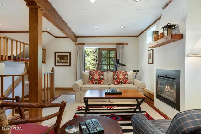 a living room with furniture fireplace and flat screen tv