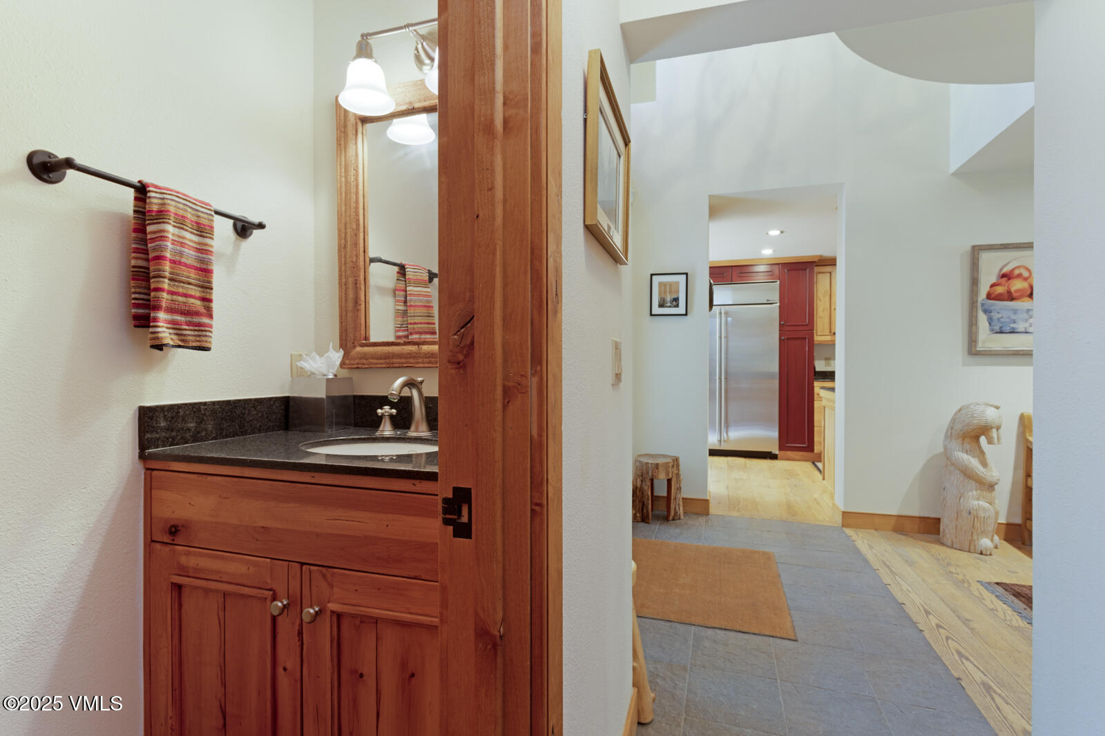 2111 Vermont Road, Unit A Vail, CO 81657 - Photo 19 of 46 a en suite bathroom with a sink and a mirror