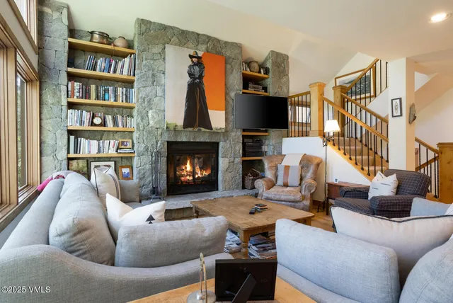a living room with furniture fireplace and a flat screen tv