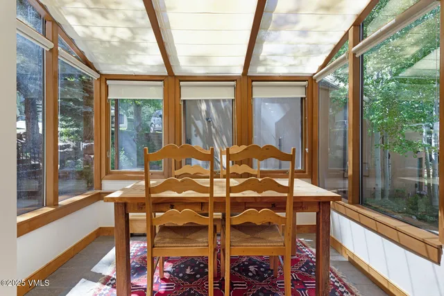 a view of a balcony with table and chairs