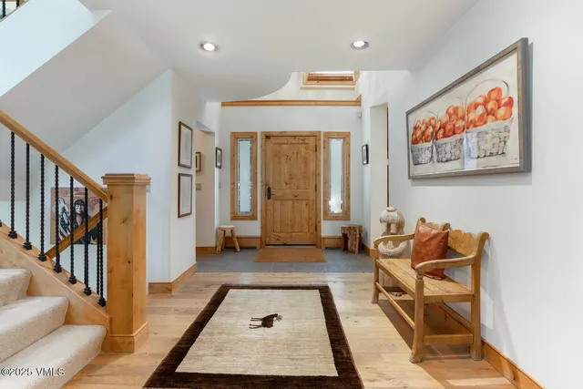 a living room with furniture and a rug