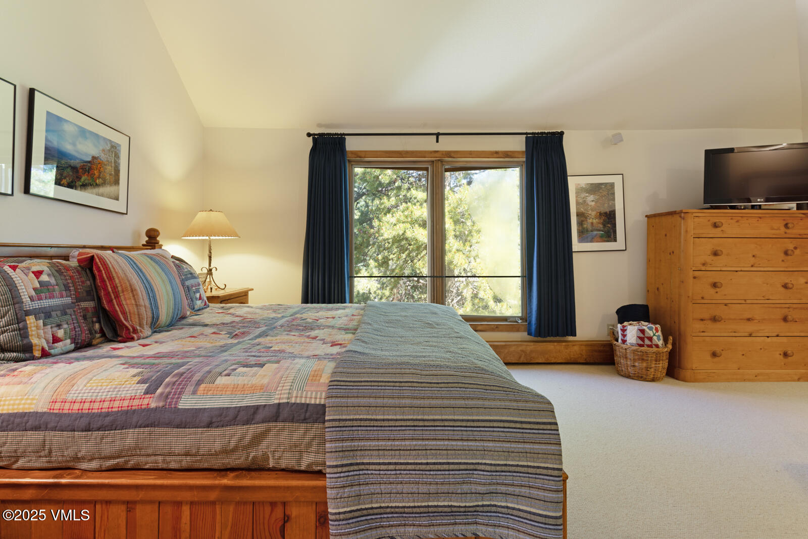 2111 Vermont Road, Unit A Vail, CO 81657 - Photo 29 of 46 a bedroom with a bed and a flat tv screen