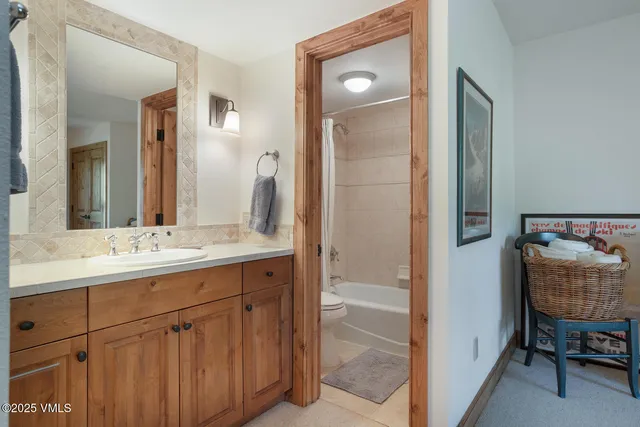 a bathroom with a sink double vanity and a mirror