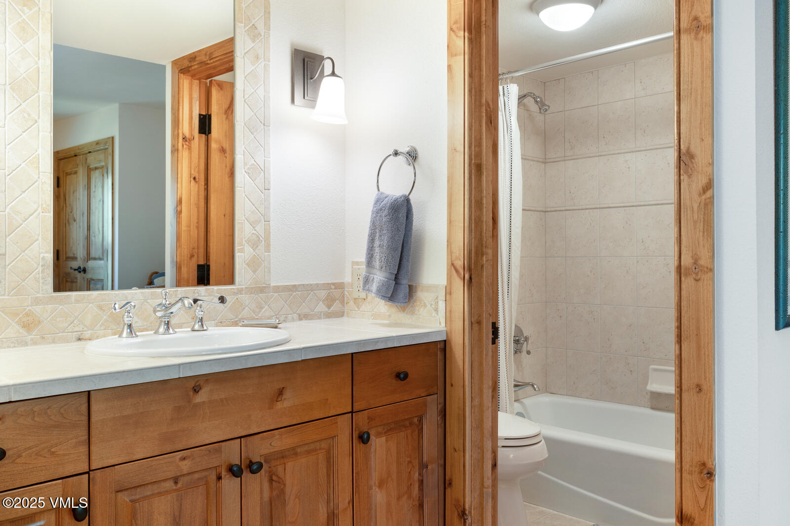 2111 Vermont Road, Unit A Vail, CO 81657 - Photo 35 of 46 a bathroom with a sink and a mirror