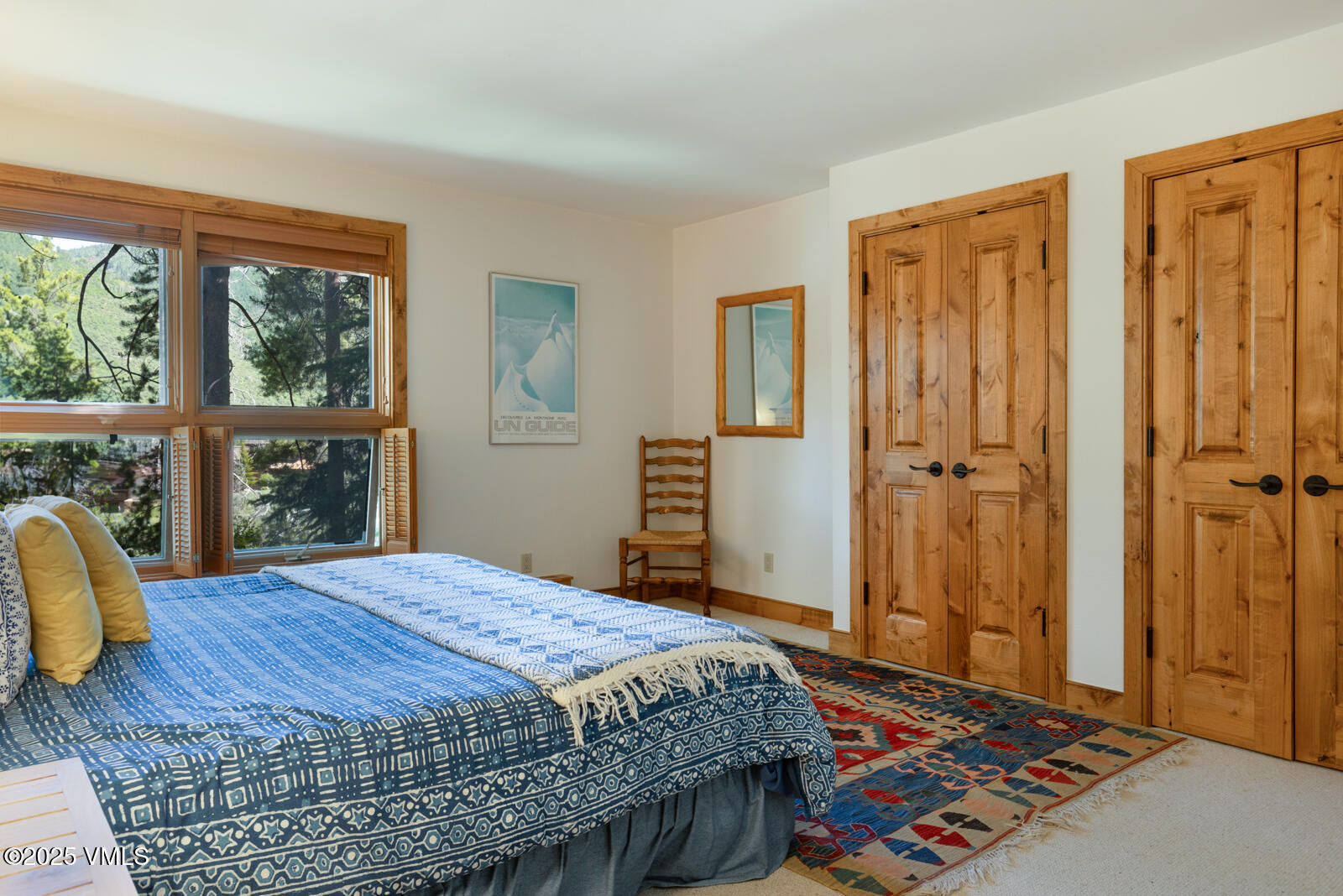 2111 Vermont Road, Unit A Vail, CO 81657 - Photo 37 of 46 a bedroom with a bed and a table in it
