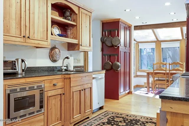 a kitchen with stainless steel appliances granite countertop a stove and a sink
