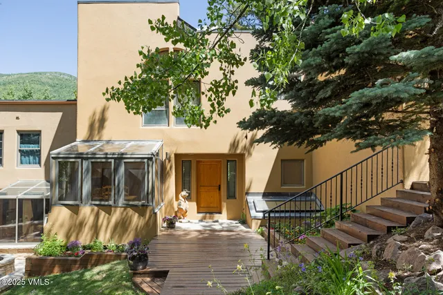 a view of house with patio outdoor seating