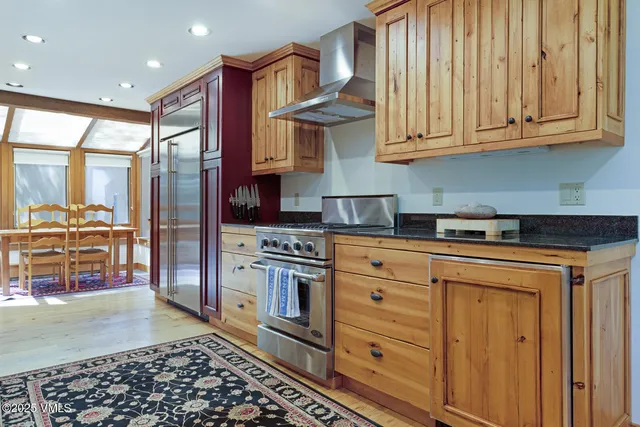a kitchen with stainless steel appliances granite countertop a stove a sink and dishwasher cabinets