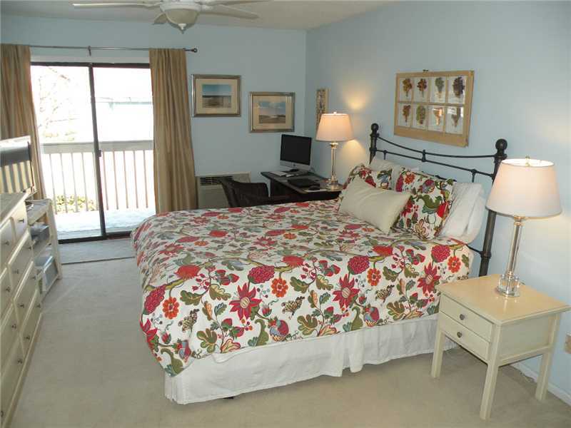 377 Glenbrook Road Stamford, CT 06906 - Photo 11 of 15 a bed room with a bed and a lamp