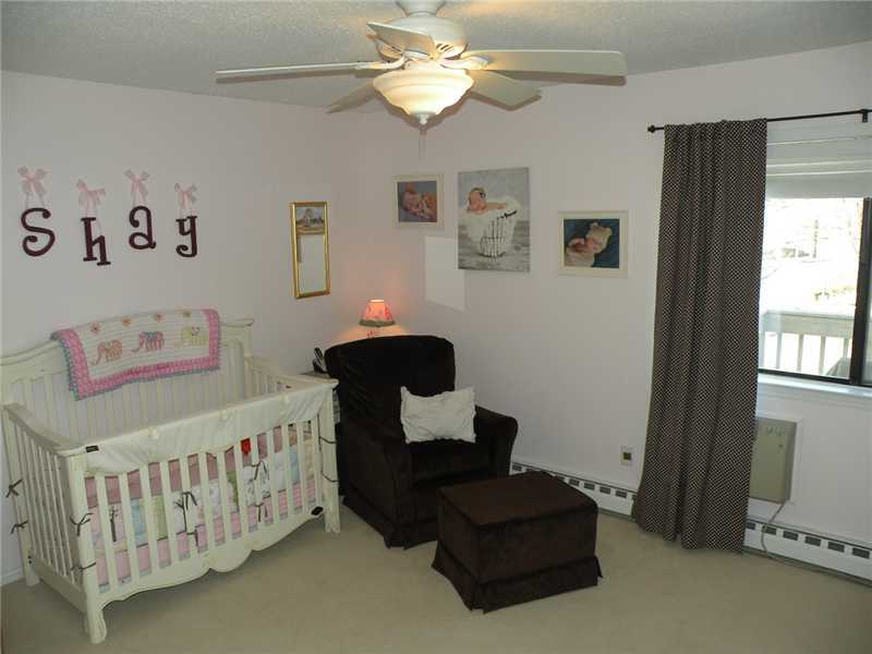 377 Glenbrook Road Stamford, CT 06906 - Photo 13 of 15 a bedroom with furniture and a window