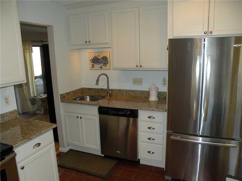 377 Glenbrook Road Stamford, CT 06906 - Photo 8 of 15 a kitchen with a refrigerator and a sink