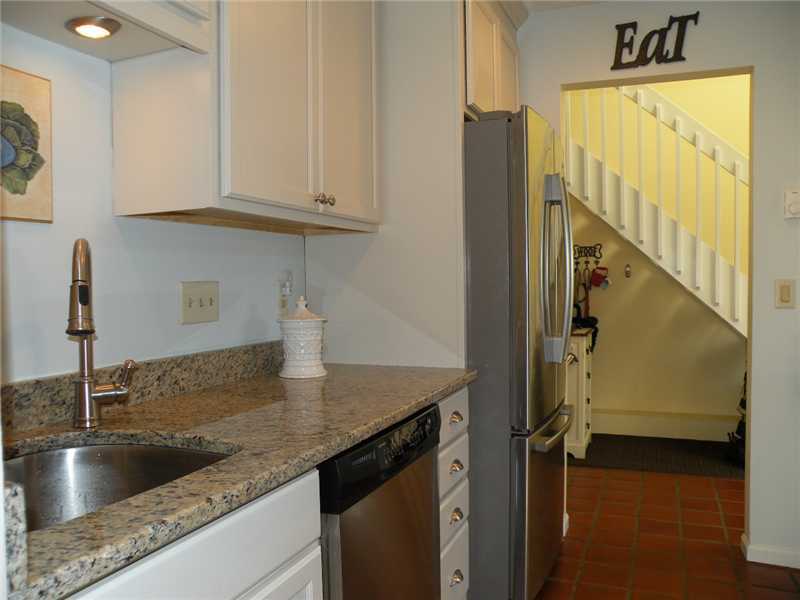 377 Glenbrook Road Stamford, CT 06906 - Photo 9 of 15 a kitchen with sink refrigerator and microwave