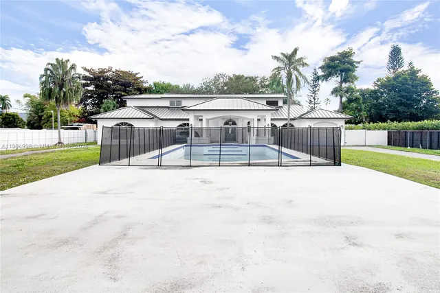 a view of a swimming pool with a patio