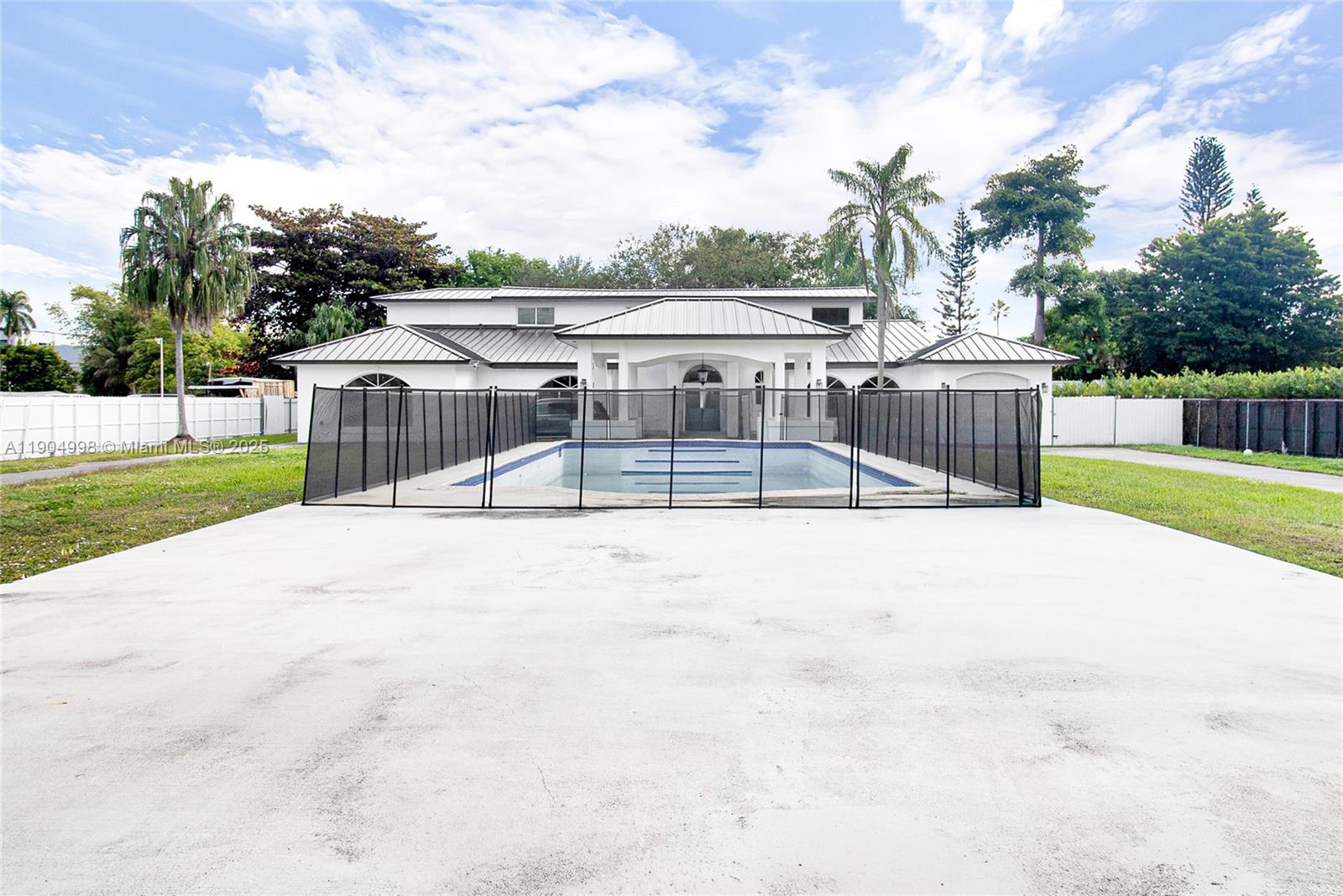 a view of a swimming pool with a patio