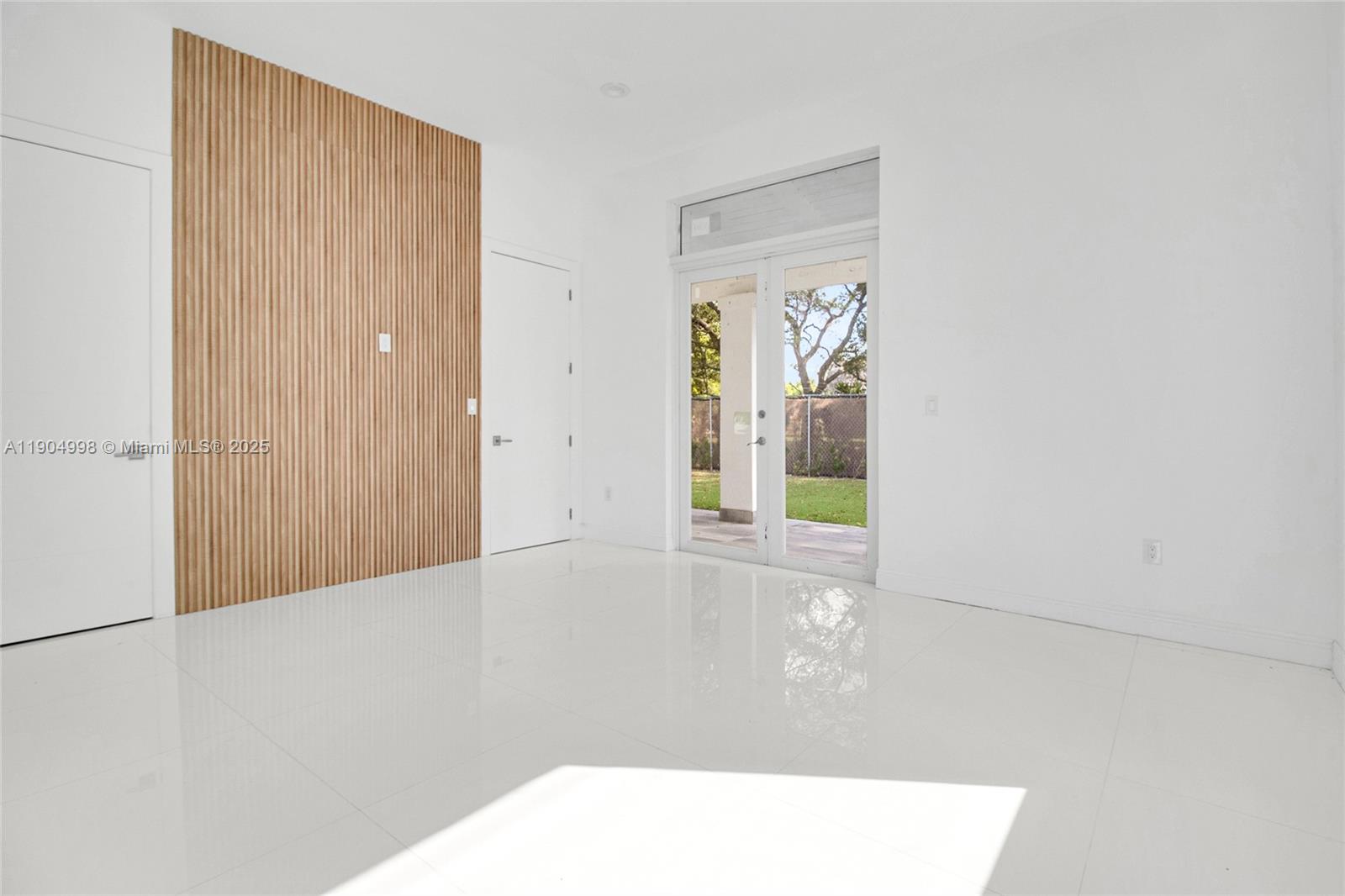 425 Southwest 129th Avenue Miami, FL 33184 - Photo 13 of 24 a view of an empty room with window