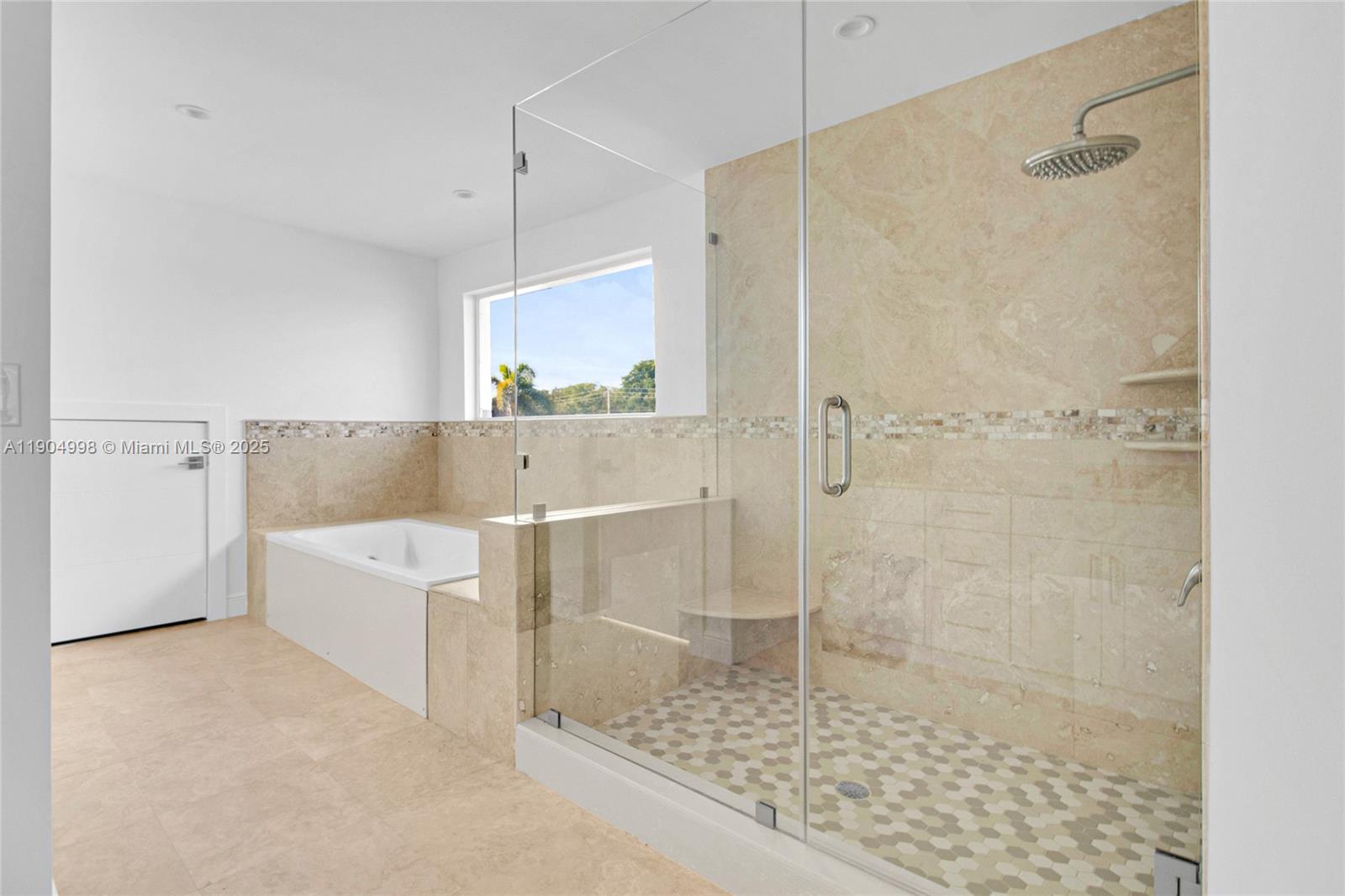 425 Southwest 129th Avenue Miami, FL 33184 - Photo 16 of 24 a bathroom with a tub and a shower