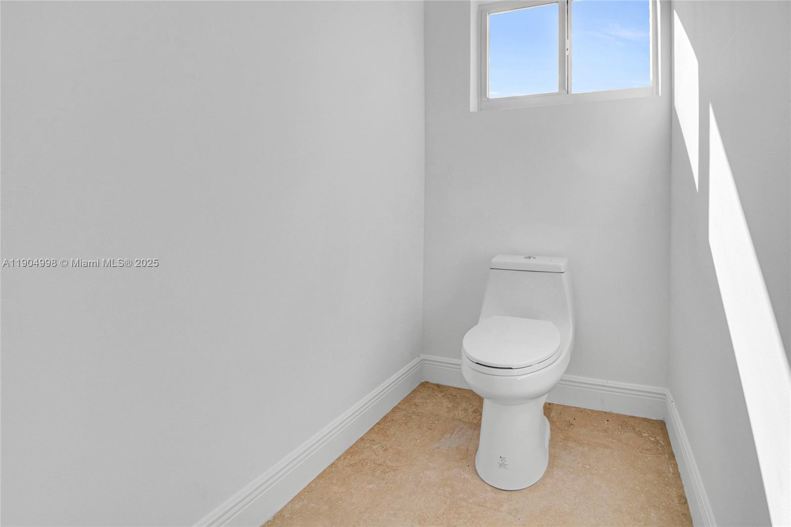 425 Southwest 129th Avenue Miami, FL 33184 - Photo 18 of 24 a bathroom with a toilet and a sink
