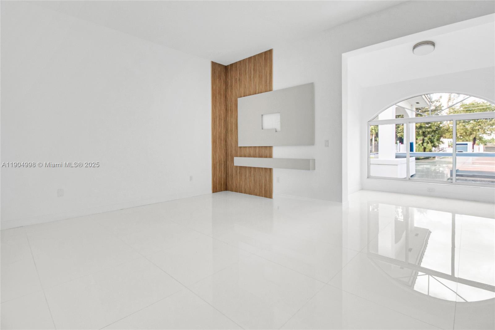 425 Southwest 129th Avenue Miami, FL 33184 - Photo 20 of 24 a view of a hallway to a livingroom with furniture